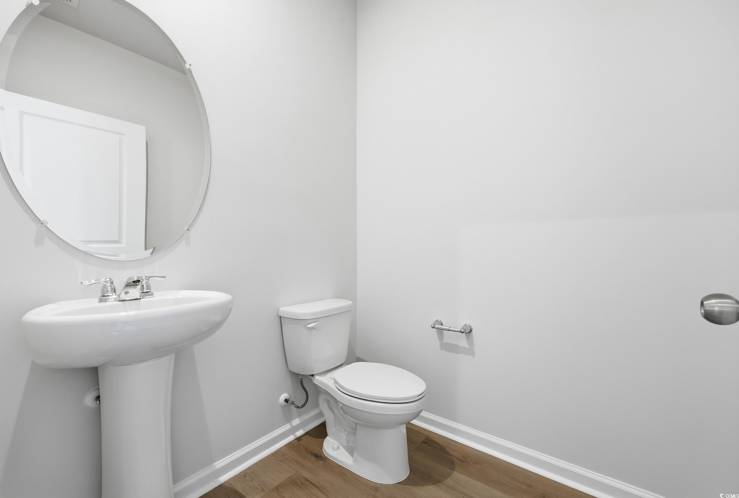 3055 Visionary Drive Myrtle Beach, SC 29588 - Photo 7 of 31 Half bathroom with baseboards and wood finished floors