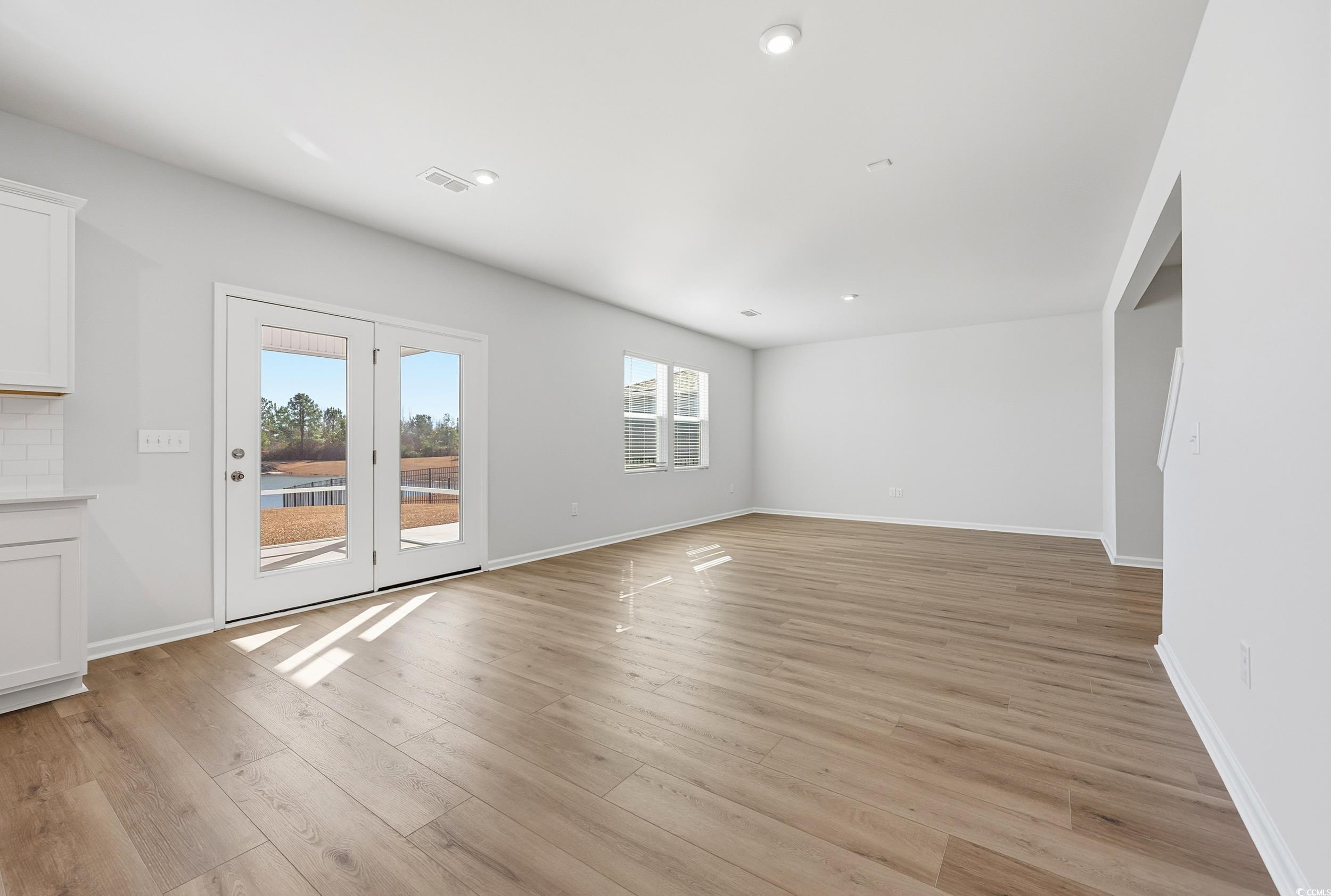 3055 Visionary Drive Myrtle Beach, SC 29588 - Photo 9 of 31 Unfurnished living room with light wood finished floors and recessed lighting