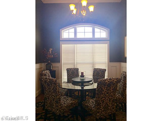 5083 Peppertree Road Clemmons, NC 27012 - Photo 13 of 16 Dining Room. Dramatic dining room with wainscotting and coffered ceilings