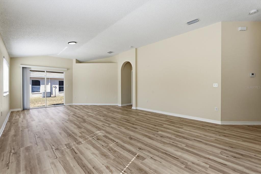 12923 Fieldmoor Court Riverview, FL 33579 - Photo 11 of 37 a view of empty room with wooden floor