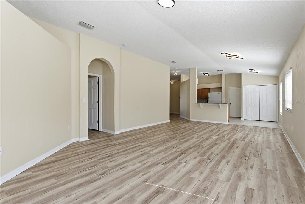 12923 Fieldmoor Court Riverview, FL 33579 - Photo 12 of 37 a view of empty room with wooden floor