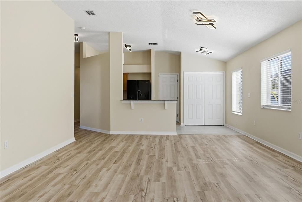 12923 Fieldmoor Court Riverview, FL 33579 - Photo 13 of 37 a view of empty room with wooden floor and window