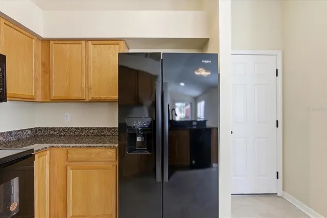 a kitchen that has a sink and a stove