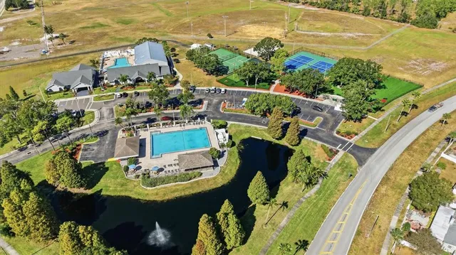 an aerial view of a house a garden and swimming pool