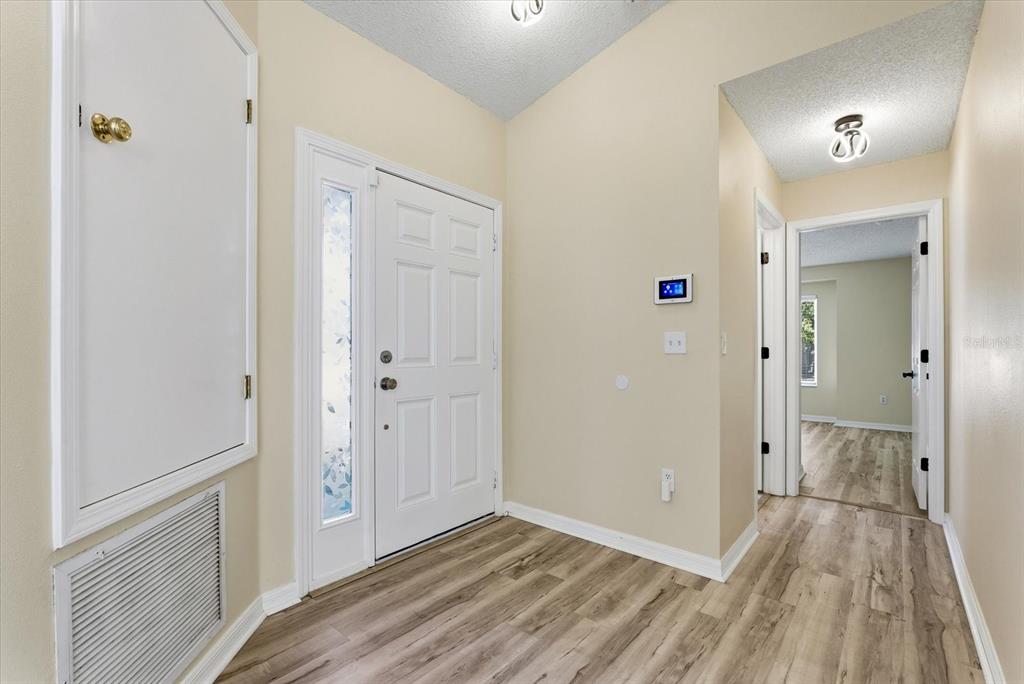 12923 Fieldmoor Court Riverview, FL 33579 - Photo 3 of 37 a view of a hallway with wooden floor