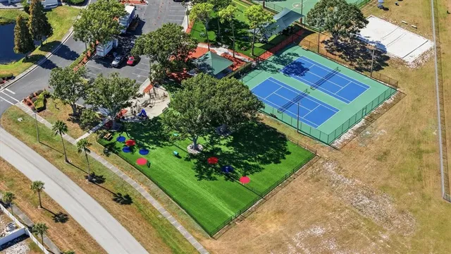 an aerial view of a houses with yard