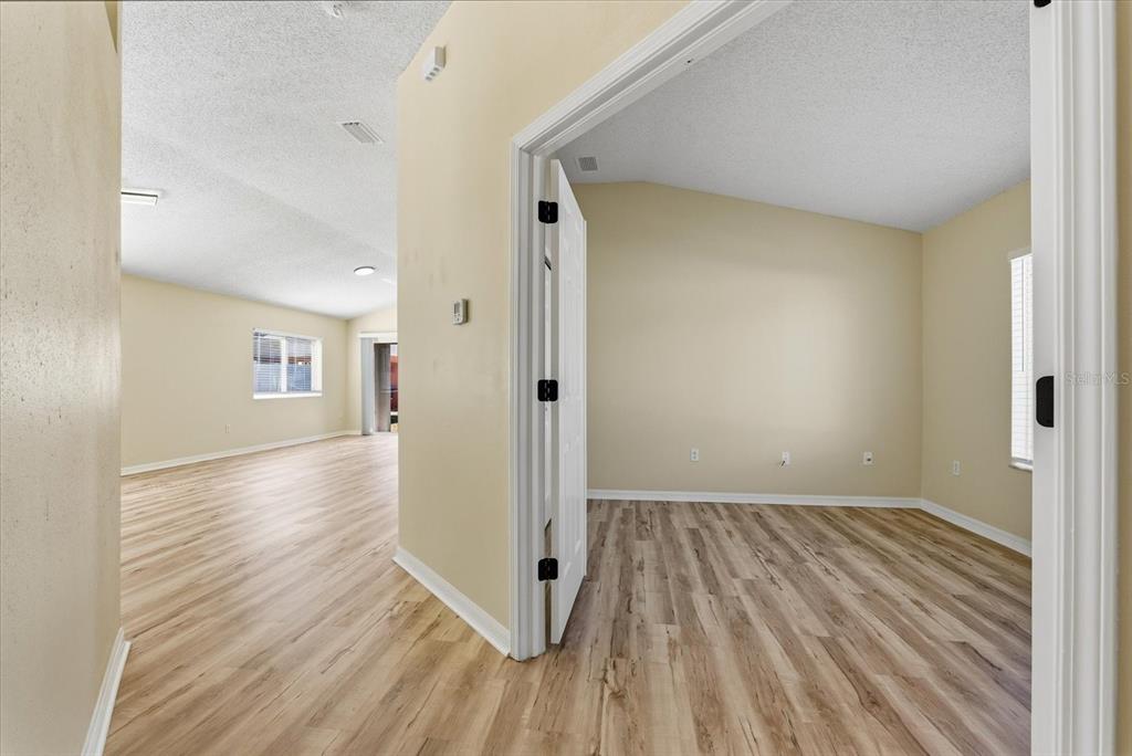 12923 Fieldmoor Court Riverview, FL 33579 - Photo 4 of 37 wooden floor in an empty room with a window