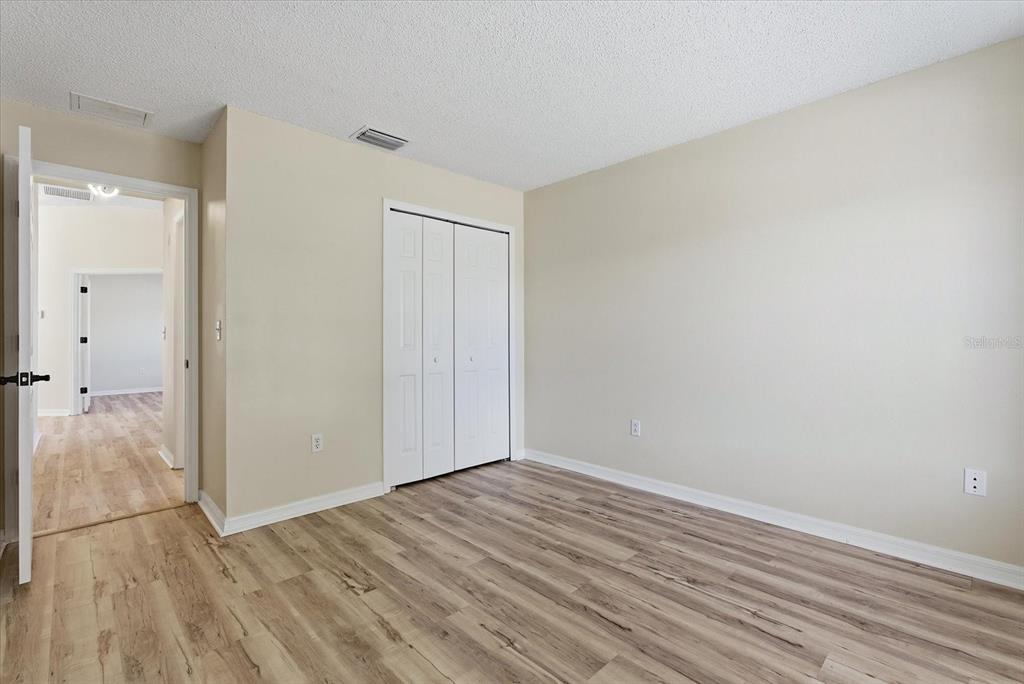 12923 Fieldmoor Court Riverview, FL 33579 - Photo 9 of 37 wooden floor in an empty room