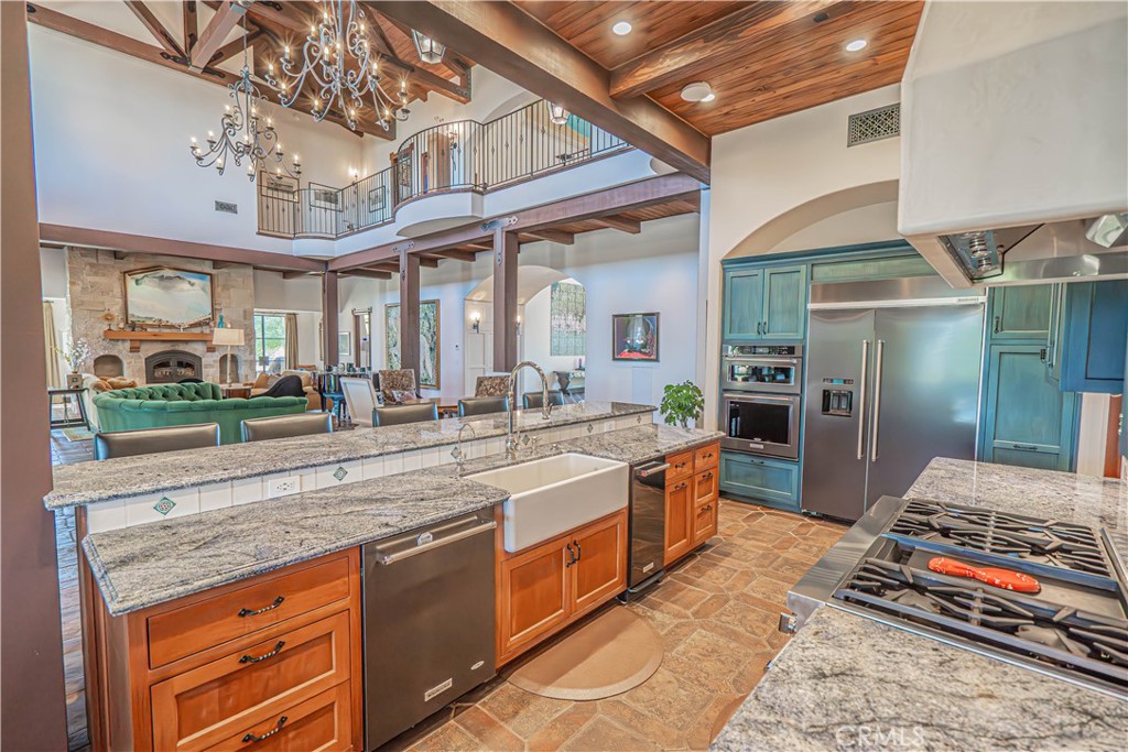3030 Templeton Road Templeton, CA 93465 - Photo 16 of 75 Custom cabinetry and gleaming granite countertops elevate the kitchen with timeless style and sophistication.