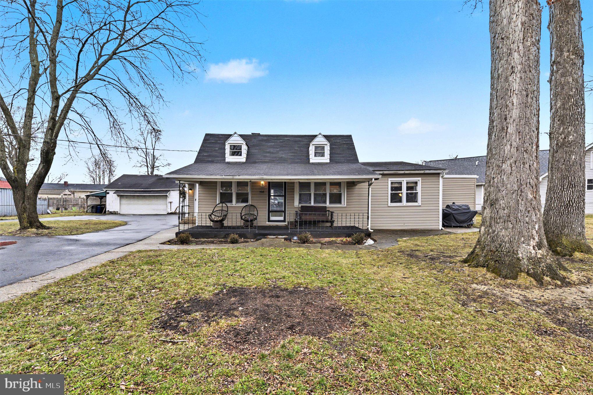 908 Meadow Avenue Baltimore, MD 21222 - Photo 1 of 26 a front view of a house with garden