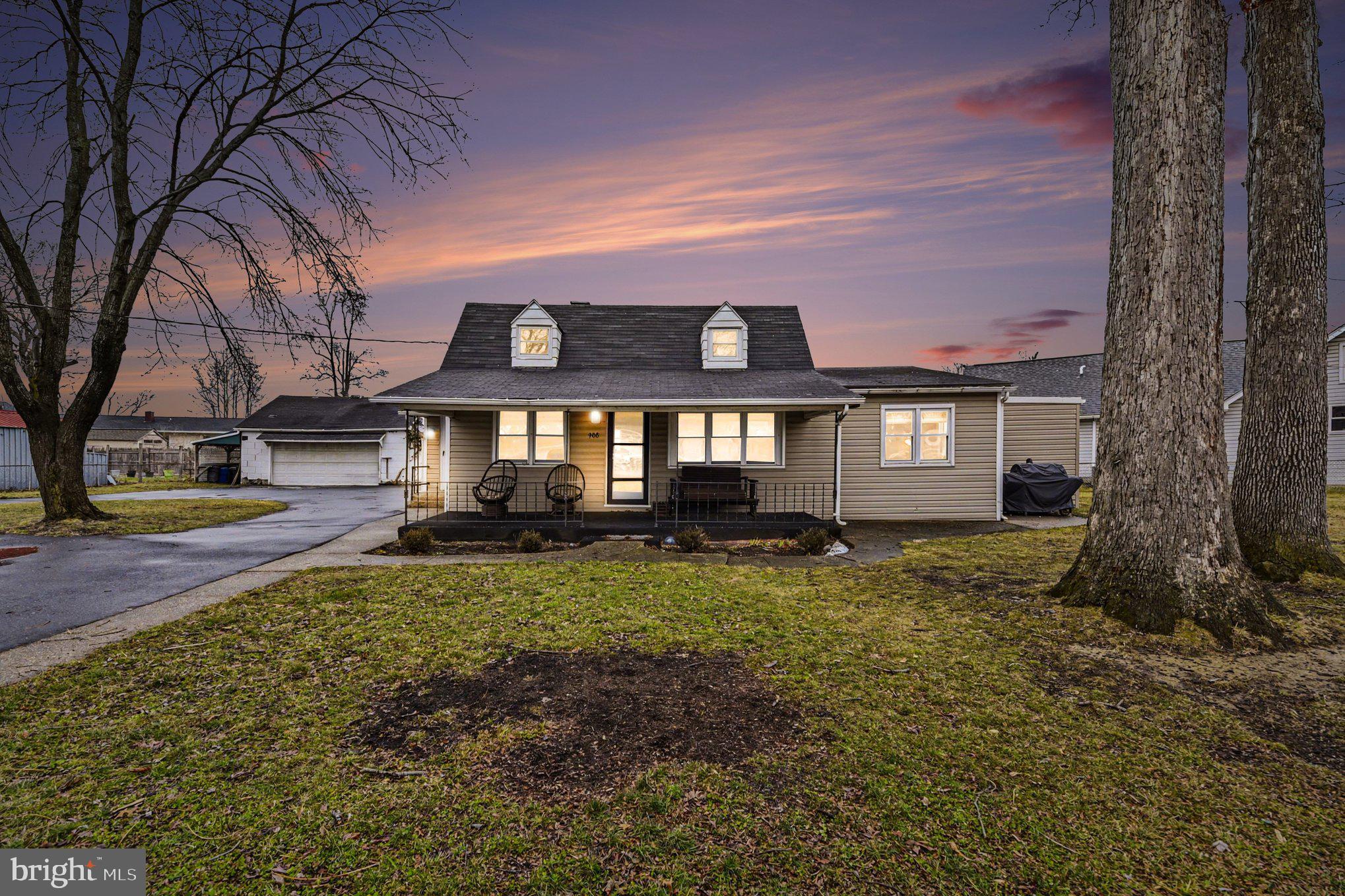 908 Meadow Avenue Baltimore, MD 21222 - Photo 2 of 26 a front view of a house with a yard