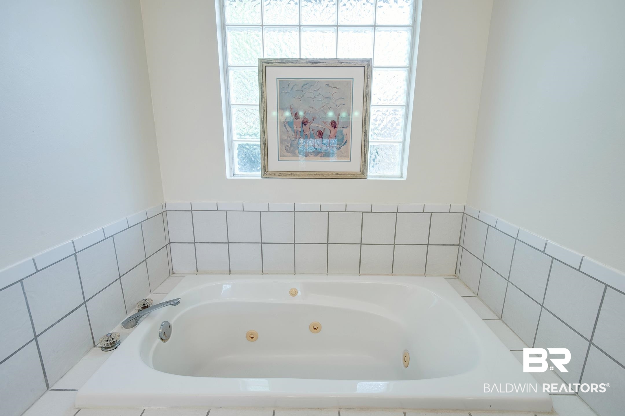 10093 Willis Road Foley, AL 36535 - Photo 11 of 33 Bathroom with a tub with jets and healthy amount of natural light