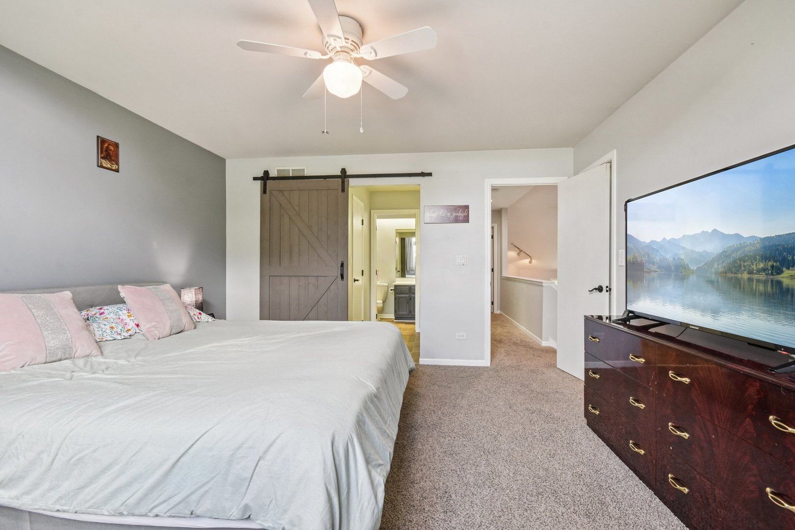 102 Ravinia Drive Shorewood, IL 60404 - Photo 17 of 30 a spacious bedroom with a bed and a flat screen tv