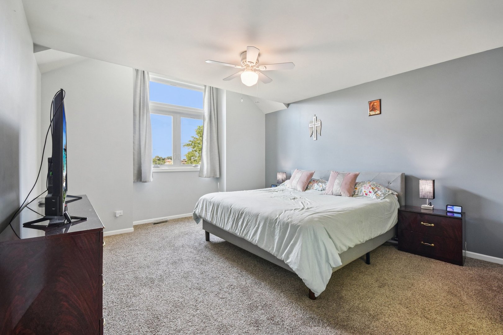 102 Ravinia Drive Shorewood, IL 60404 - Photo 18 of 30 a bedroom with a bed and a chandelier