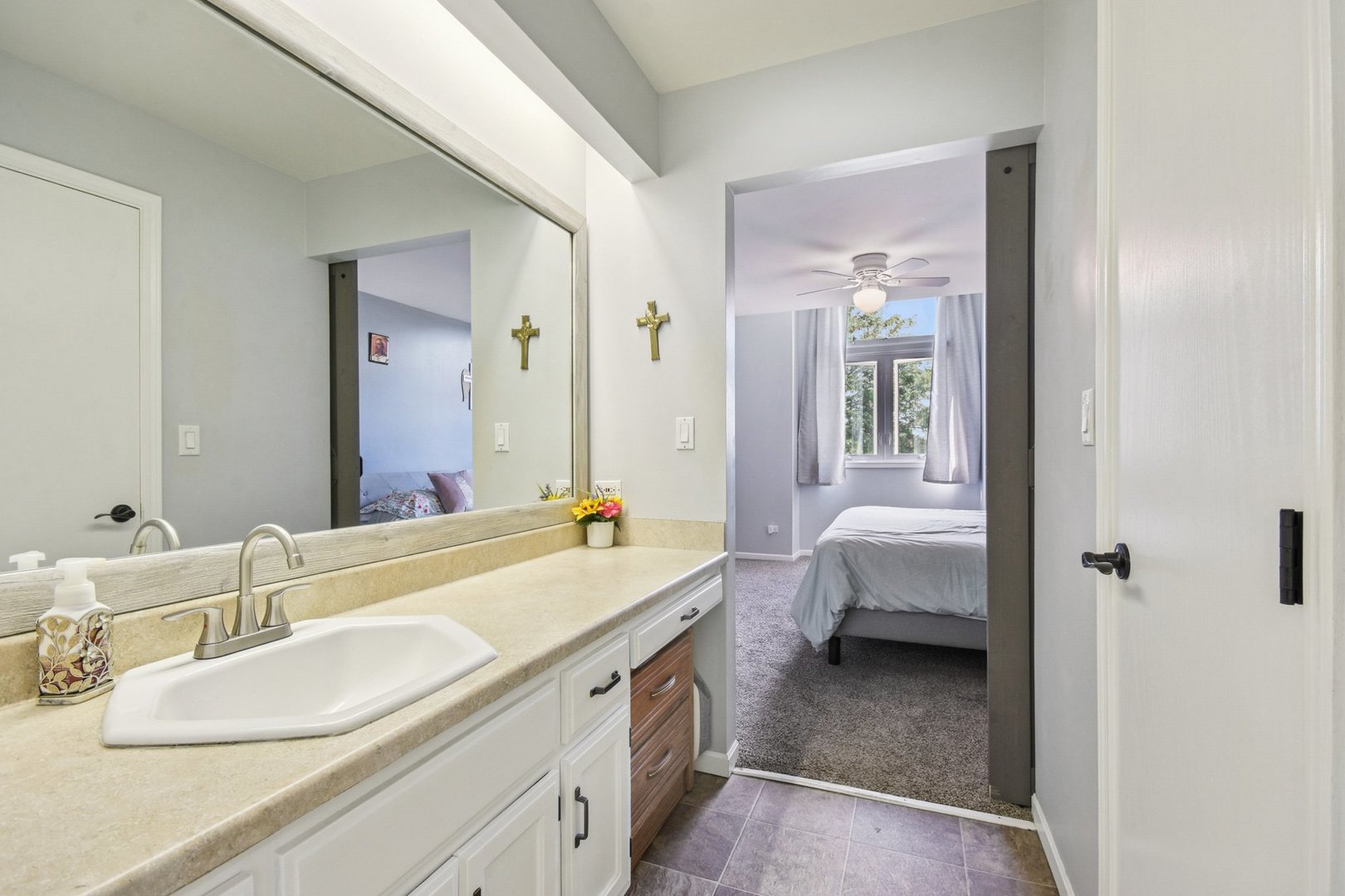 102 Ravinia Drive Shorewood, IL 60404 - Photo 19 of 30 a en suite bathroom with a double vanity sink and a mirror