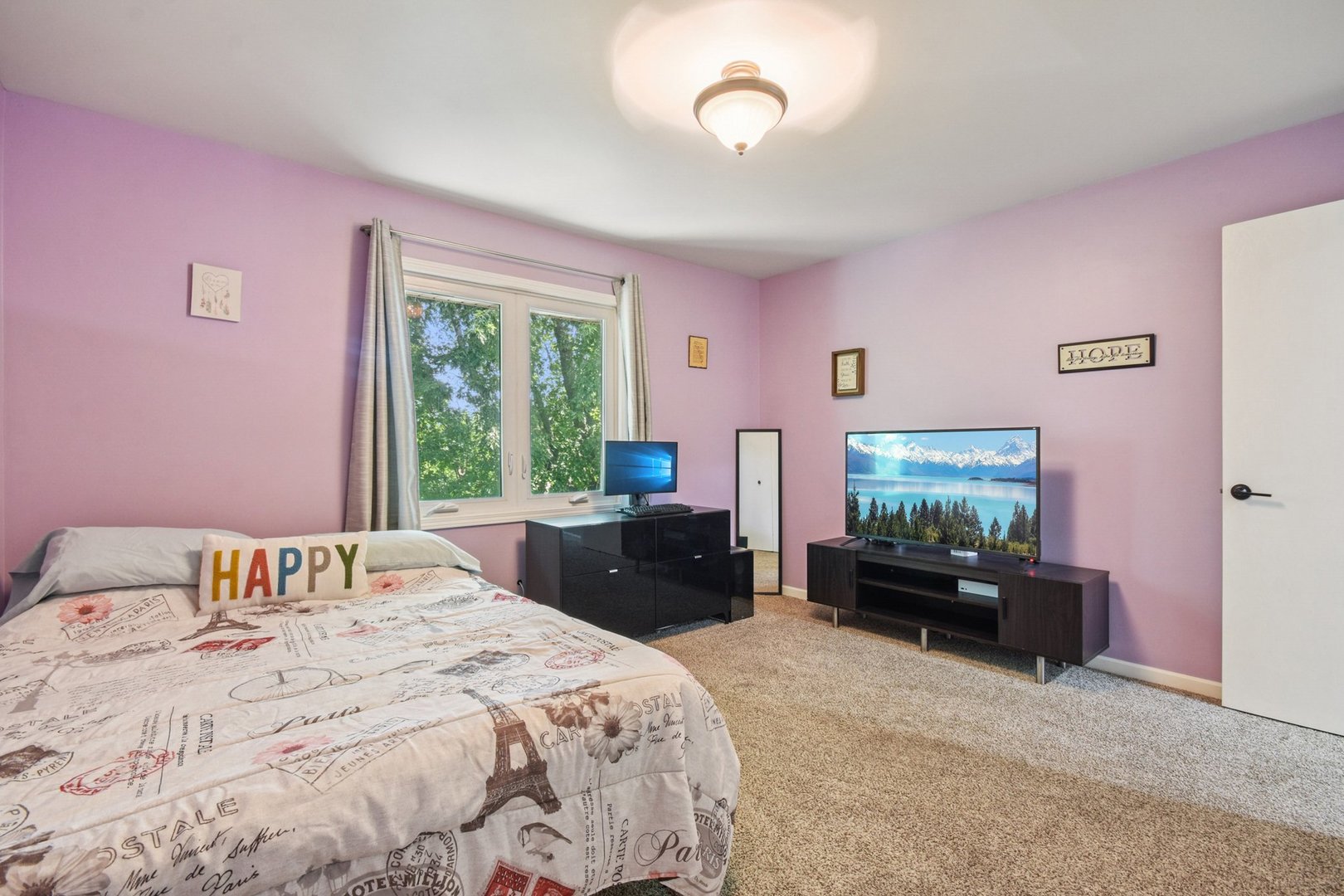 102 Ravinia Drive Shorewood, IL 60404 - Photo 21 of 30 a bedroom with a bed couch tv and a window