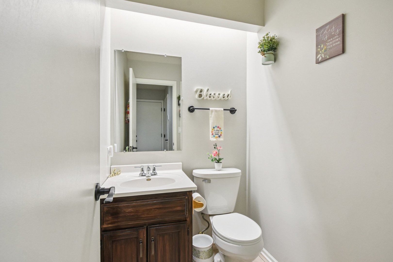 102 Ravinia Drive Shorewood, IL 60404 - Photo 25 of 30 a bathroom with a sink a toilet and a mirror