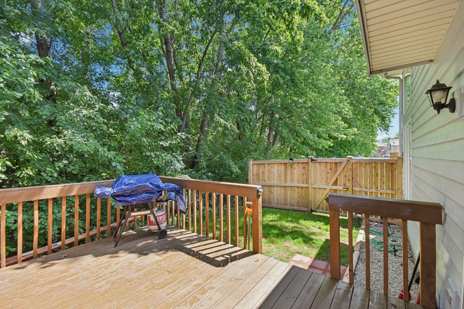 102 Ravinia Drive Shorewood, IL 60404 - Photo 28 of 30 a view of a wooden deck and a backyard