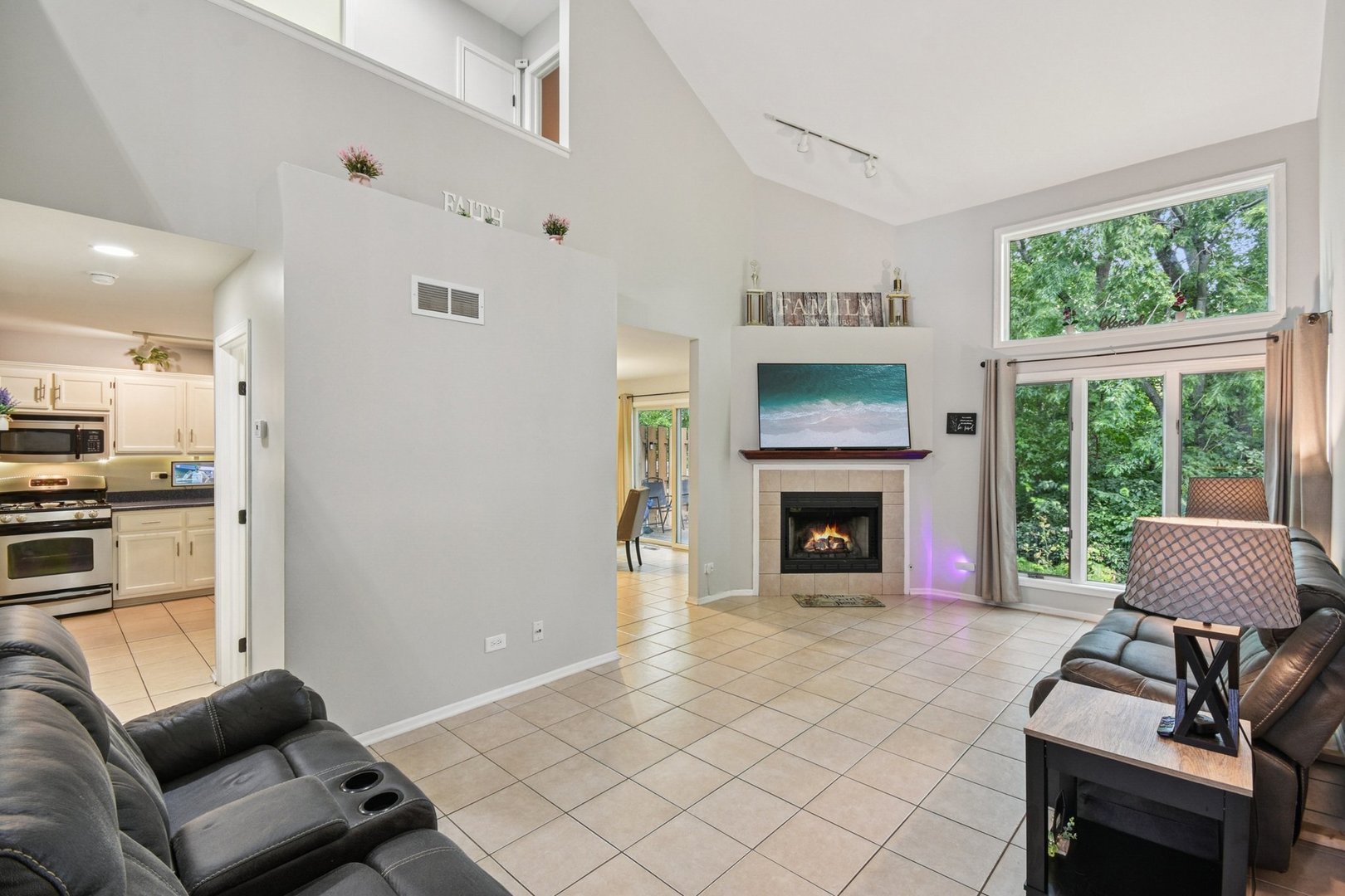 102 Ravinia Drive Shorewood, IL 60404 - Photo 5 of 30 a living room with furniture and a fireplace