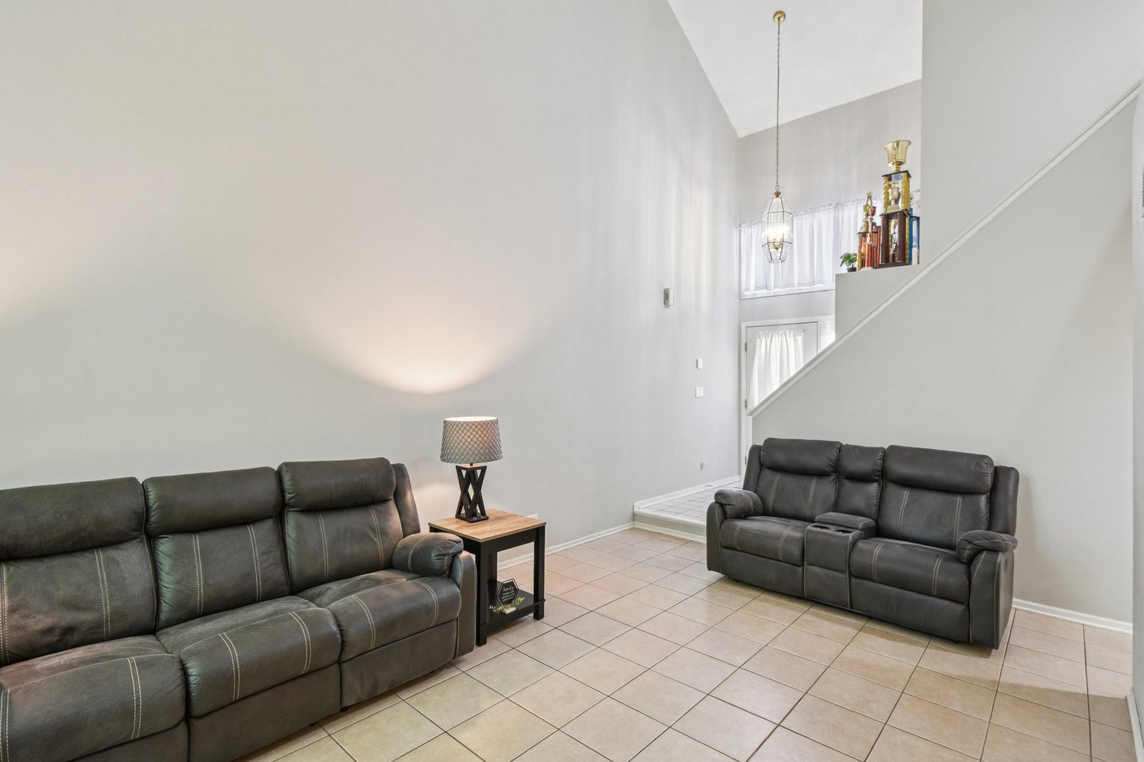 102 Ravinia Drive Shorewood, IL 60404 - Photo 7 of 30 a living room with furniture and a couch
