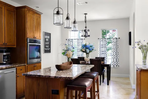 a dining room with furniture and wooden floor