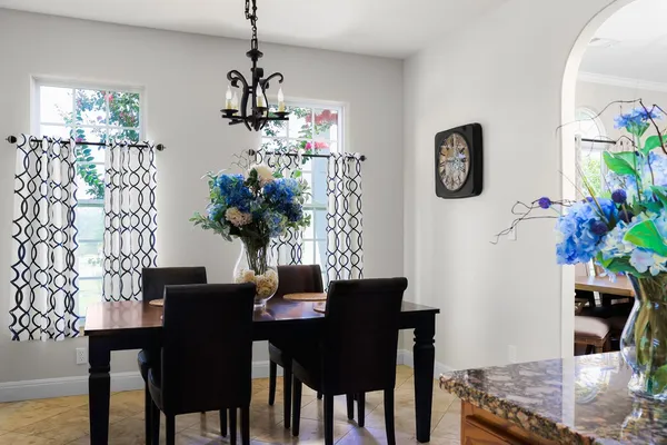 a dining room with furniture and window