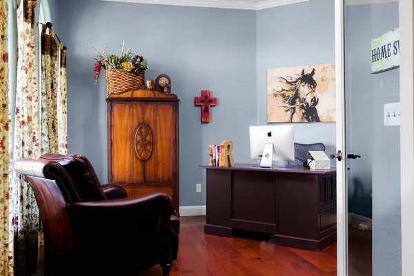 a living room with furniture and a window