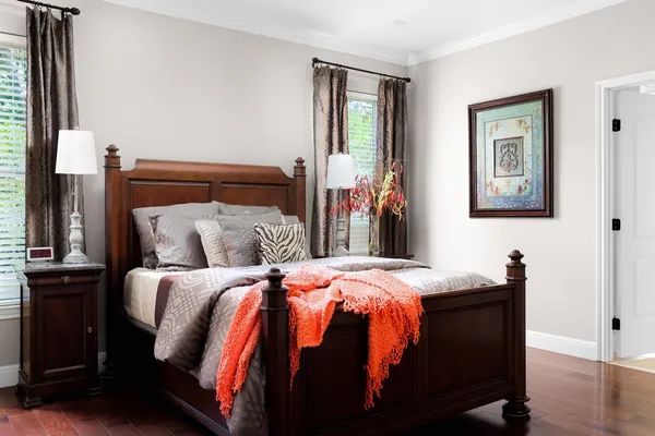 a bed room with a bed and a painting