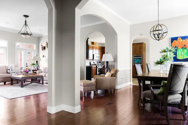 a view of a dining room with furniture window and wooden floor