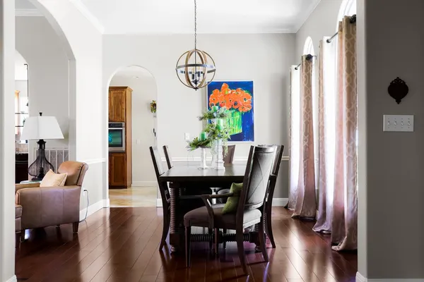 a view of a dining room with furniture window and wooden floor