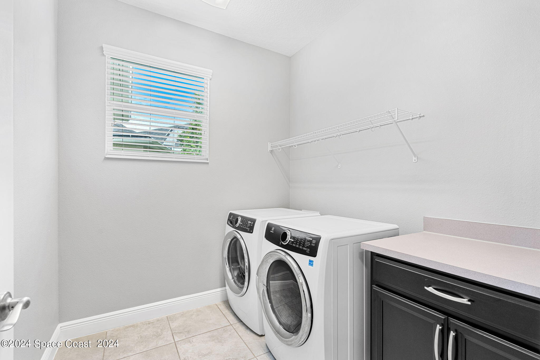 3034 Casterton Drive Melbourne, FL 32940 - Photo 22 of 38 a utility room with dryer and washer