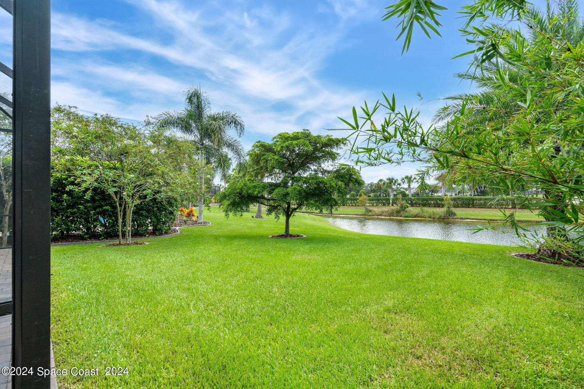 3034 Casterton Drive Melbourne, FL 32940 - Photo 28 of 38 a view of a garden with a tree