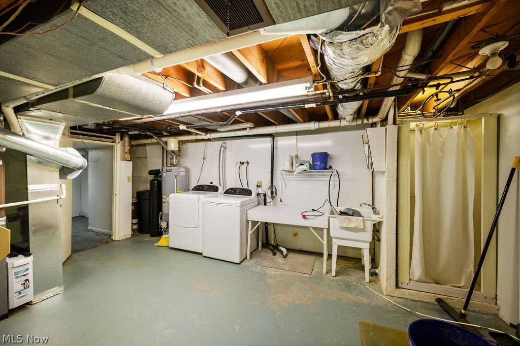 11363 Dupont Road Washington, WV 26181 - Photo 24 of 42 Utility room with concrete flooring, exposed ceiling joists, and a built-in shower stall