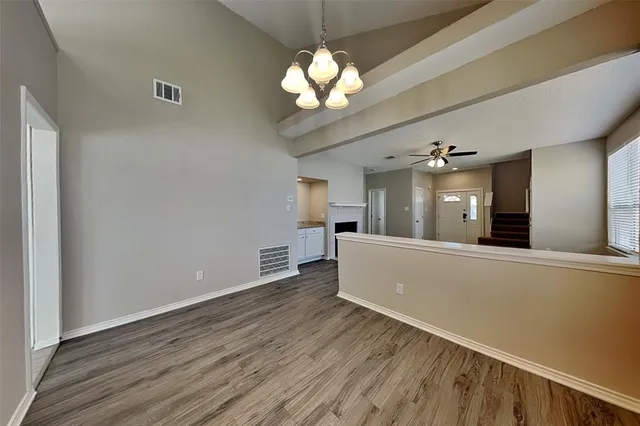 a view of a living room with a large window