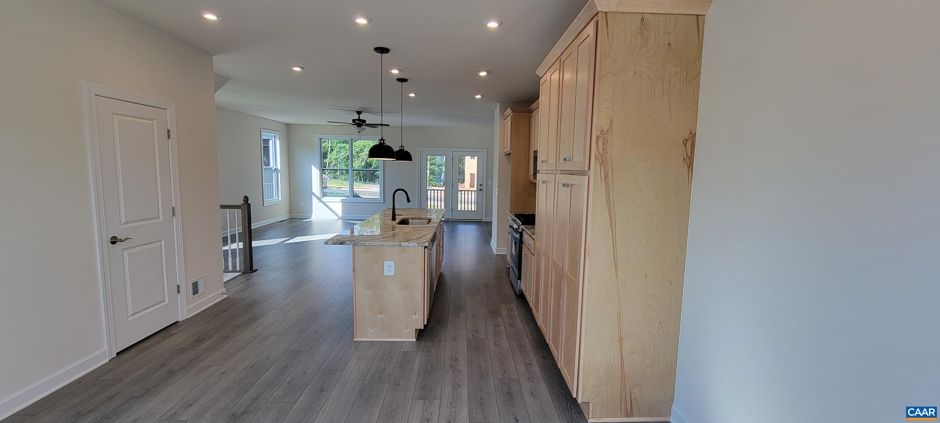 2245 Fowler Street Charlottesville, VA 22901 - Photo 17 of 38 a view of a hallway with wooden floor fireplace and living room
