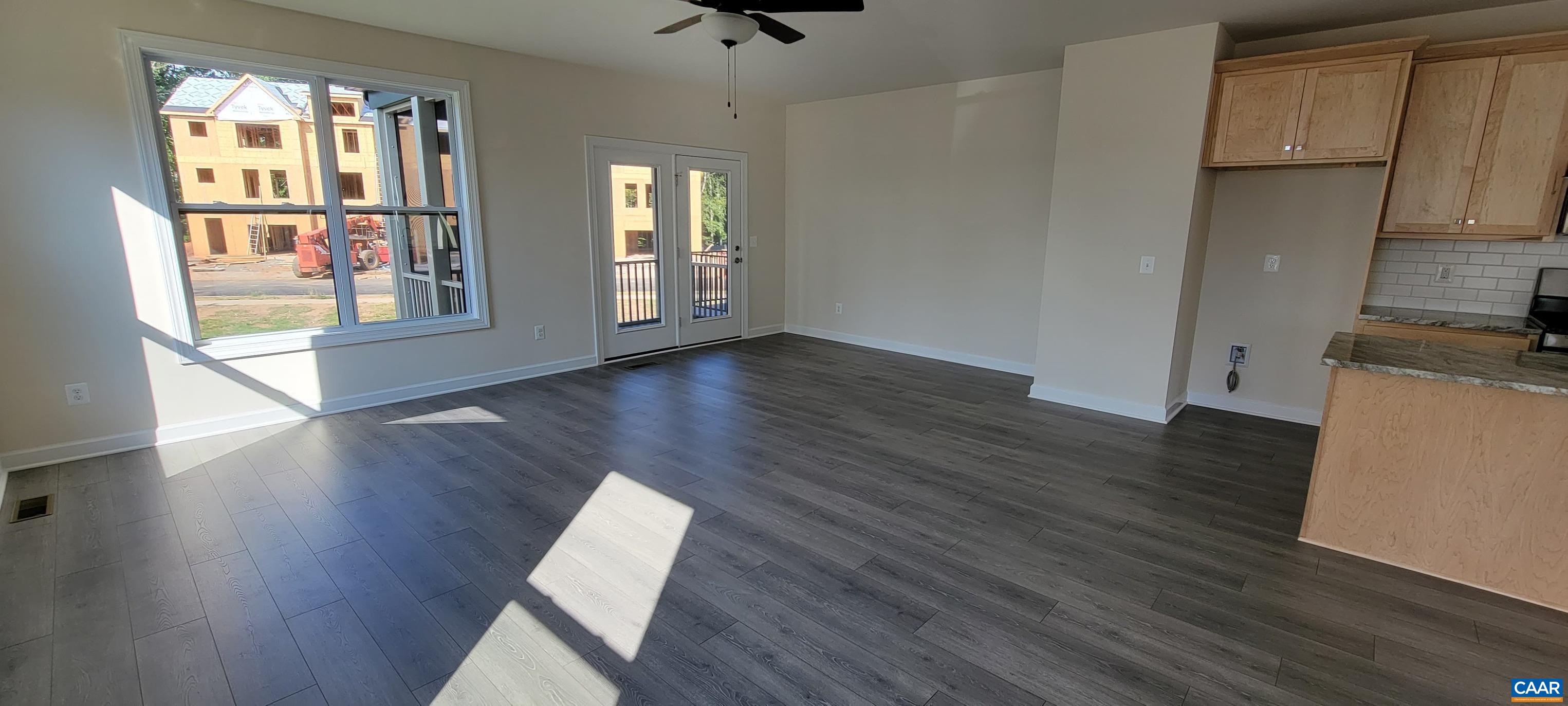 2245 Fowler Street Charlottesville, VA 22901 - Photo 20 of 38 an empty room with wooden floor and windows
