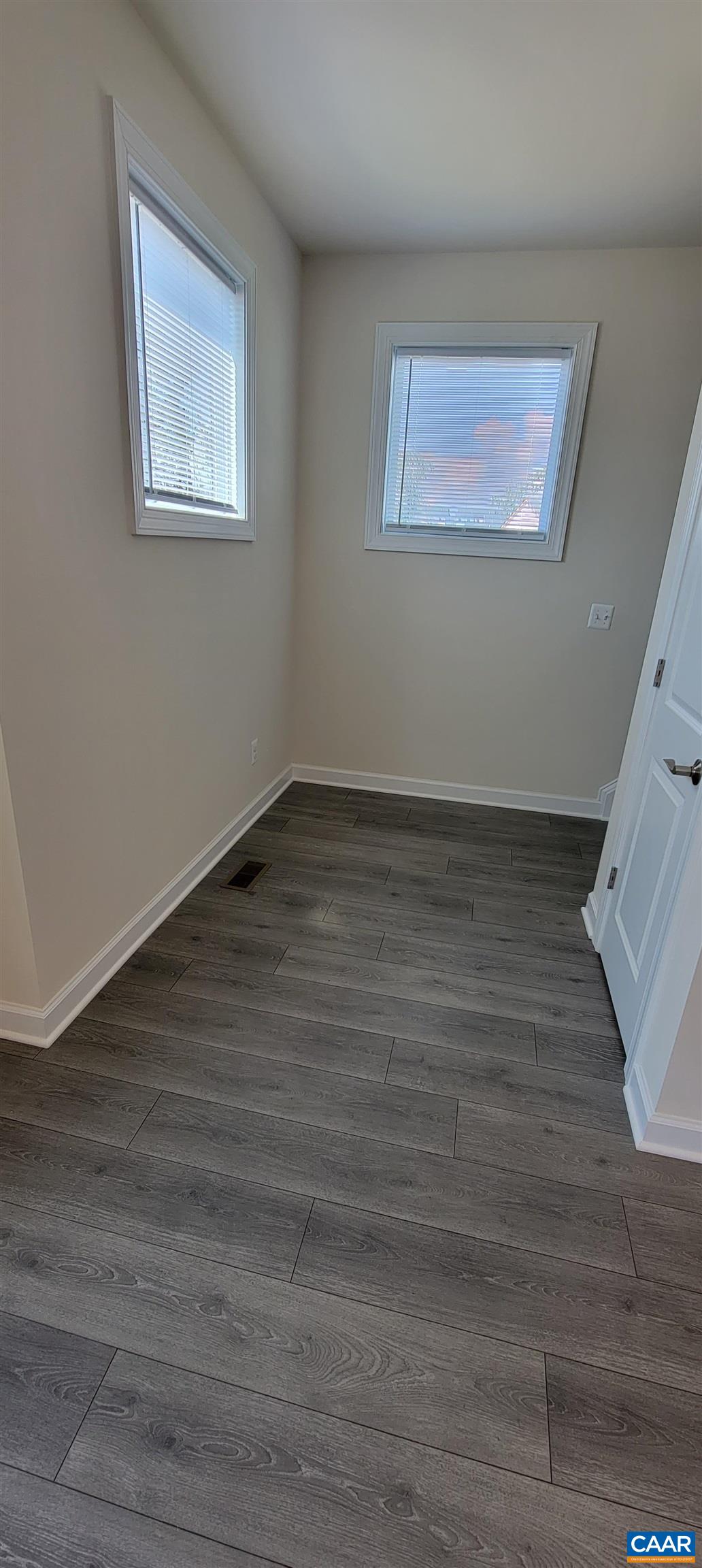 2245 Fowler Street Charlottesville, VA 22901 - Photo 23 of 38 a view of an empty room with wooden floor and a window