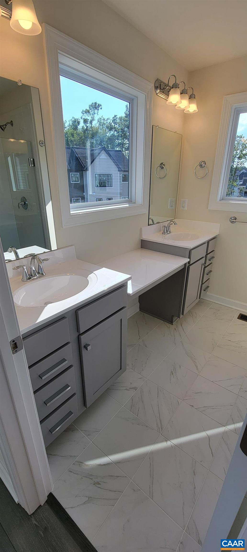 2245 Fowler Street Charlottesville, VA 22901 - Photo 25 of 38 a bathroom with a sink and a mirror