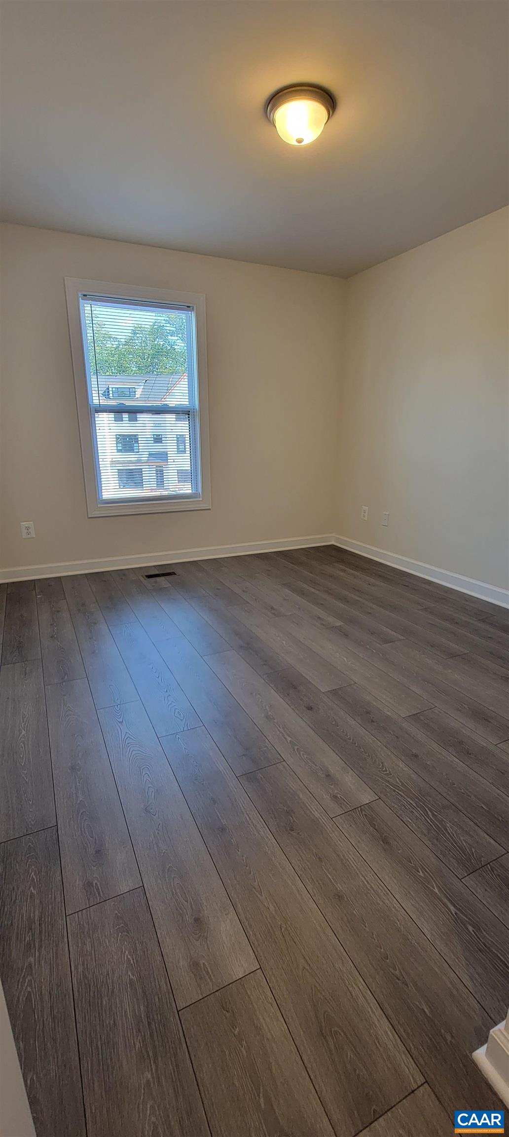 2245 Fowler Street Charlottesville, VA 22901 - Photo 29 of 38 an empty room with wooden floor and windows