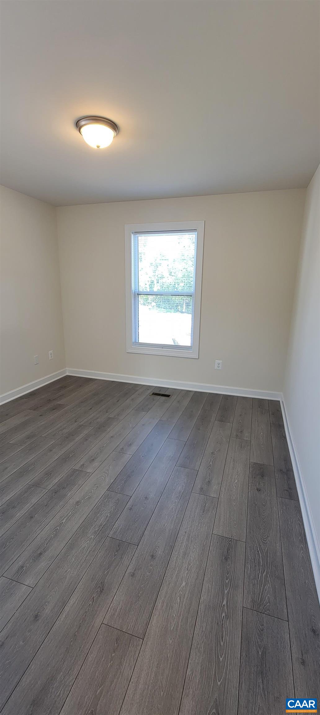 2245 Fowler Street Charlottesville, VA 22901 - Photo 30 of 38 an empty room with wooden floor and windows