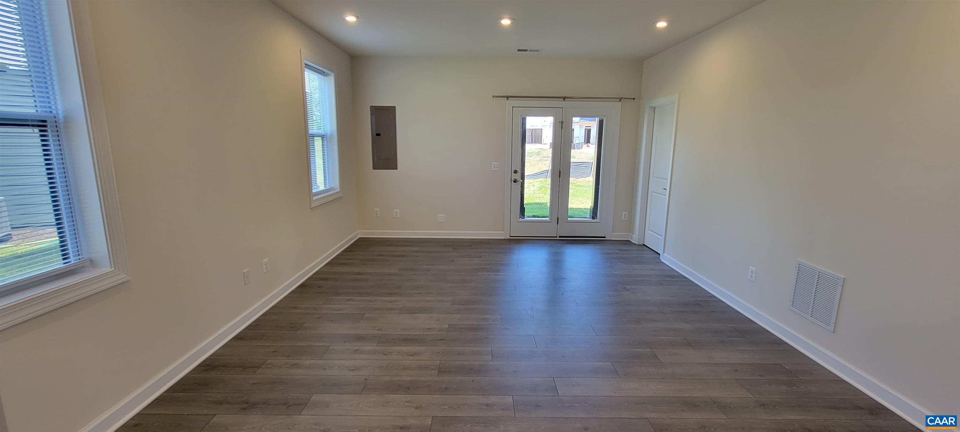 2245 Fowler Street Charlottesville, VA 22901 - Photo 4 of 38 a view of an empty room with wooden floor and a window