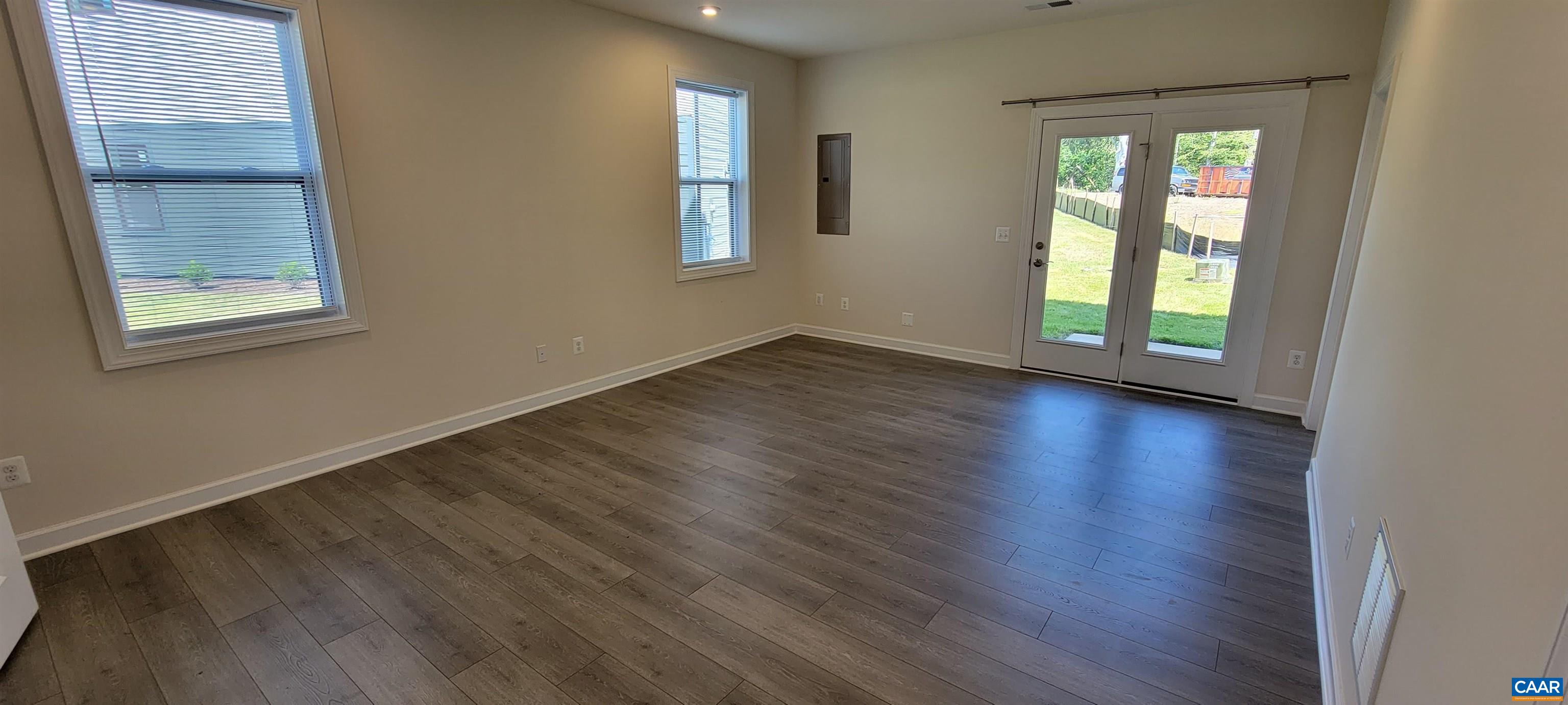 2245 Fowler Street Charlottesville, VA 22901 - Photo 5 of 38 a view of an empty room with wooden floor and a window