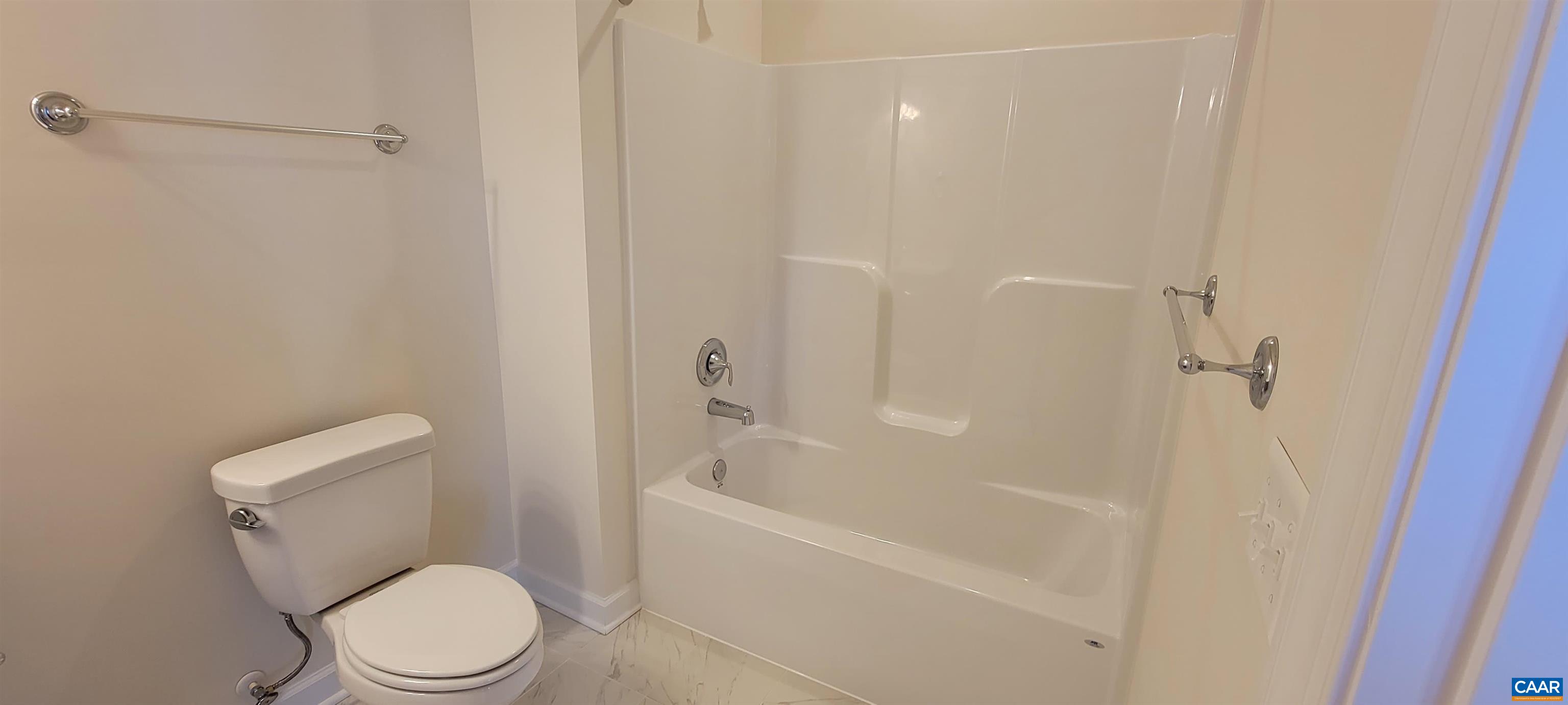 2245 Fowler Street Charlottesville, VA 22901 - Photo 7 of 38 a white toilet and tub next to a shower