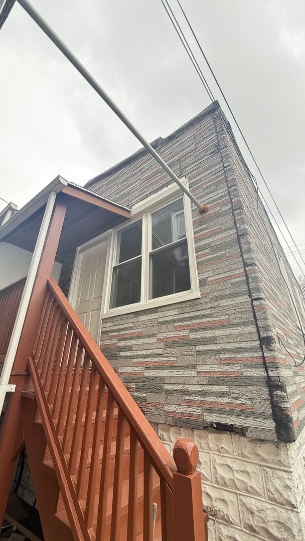 2942 West Pershing Road Chicago, IL 60632 - Photo 11 of 16 a view of a house with a window