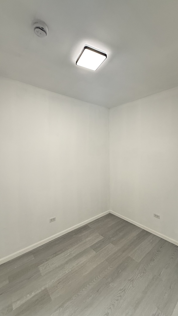 2942 West Pershing Road Chicago, IL 60632 - Photo 14 of 16 wooden floor and white walls