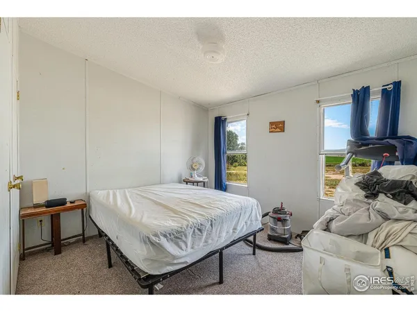 a bedroom with a bed and a table in it