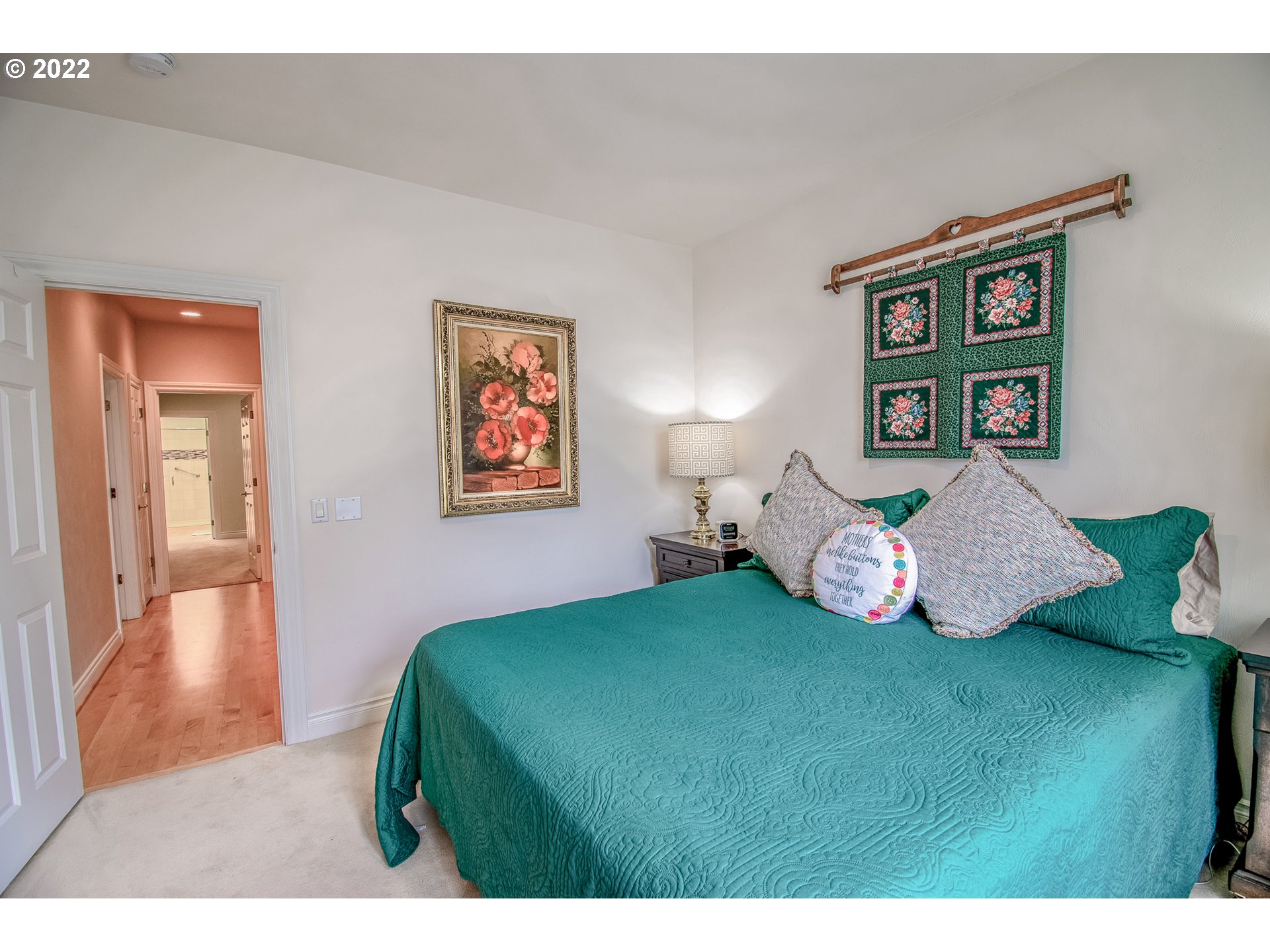 2679 Riverwalk Loop Eugene, OR 97401 - Photo 17 of 32 a bedroom with a bed and a painting on the wall