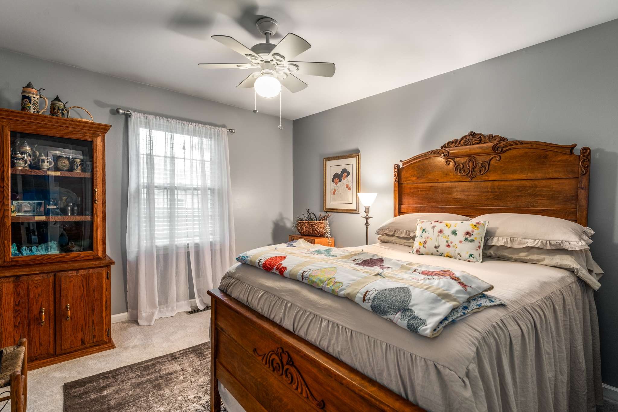513 Rose Circle Murfreesboro, TN 37128 - Photo 23 of 37 a bedroom with a bed a dresser and a book shelf