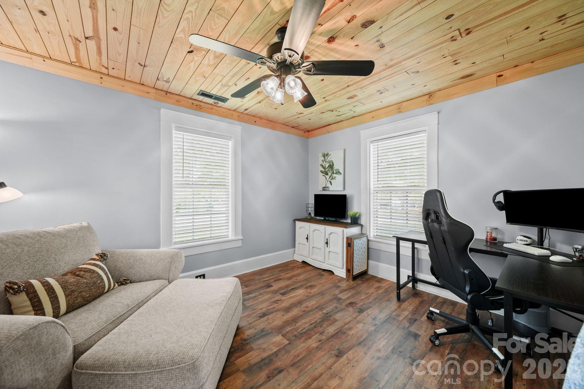 9215 Stokes Ferry Road Salisbury, NC 28146 - Photo 14 of 22 a living room with furniture and a wooden floor