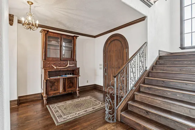 a view of an entryway with wooden floor